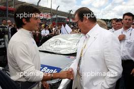 24.06.2007 Nürnberg, Germany,  Roger Moore (GBR), former "James Bond", visting Bruno Spengler (CDN), Team HWA AMG Mercedes, Portrait, on the grid - DTM 2007 at Norisring