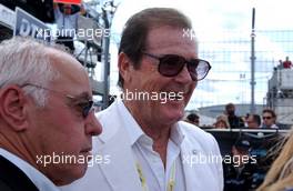 24.06.2007 Nürnberg, Germany,  (left) Hans Werner Aufrecht (GER), Team Chef HWA, ITR President with former James Bond, Roger Moore on the grid. - DTM 2007 at Norisring