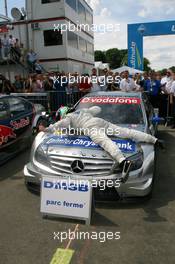 24.06.2007 Nürnberg, Germany,  Bruno Spengler (CDN), Team HWA AMG Mercedes, AMG Mercedes C-Klasse, thanking his car for another victory - DTM 2007 at Norisring