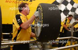 24.06.2007 Nürnberg, Germany,  Dunlop mechanic working on the tyres. - DTM 2007 at Norisring