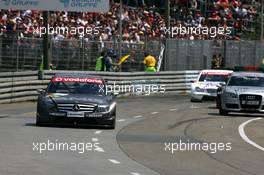 24.06.2007 Nürnberg, Germany,  Mika Häkkinen (FIN), Team HWA AMG Mercedes, AMG Mercedes C-Klasse, drives slowly on the track, to be overtaken by the safety car - DTM 2007 at Norisring