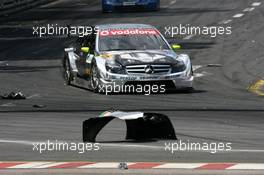 24.06.2007 Nürnberg, Germany,  Bernd Schneider (GER), Team HWA AMG Mercedes, AMG Mercedes C-Klasse passes parts of damaged car of Vanina Ickx (BEL), TME, Audi A4 DTM - DTM 2007 at Norisring