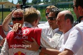 14.07.2007 Scarperia, Italy,  Mattias Ekström (SWE), Audi Sport Team Abt Sportsline, Portrait, receiving congratulations for his pole position from Hans-Jurgen Abt (GER), Teamchef Abt-Audi (center) and Dr. Wolfgang Ullrich (GER), Audi's Head of Sport - DTM 2007 at Autodromo Internazionale del Mugello