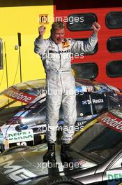 15.07.2007 Scarperia, Italy,  Race winner Mika Häkkinen (FIN), Team HWA AMG Mercedes, Portrait, standing on his car - DTM 2007 at Autodromo Internazionale del Mugello