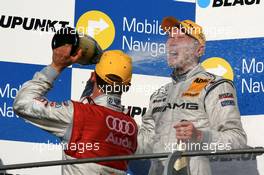 15.07.2007 Scarperia, Italy,  Podium, Mattias Ekström (SWE), Audi Sport Team Abt Sportsline, Portrait (2nd, left), gives Mika Häkkinen (FIN), Team HWA AMG Mercedes, Portrait (1st, right), a champaign shower - DTM 2007 at Autodromo Internazionale del Mugello