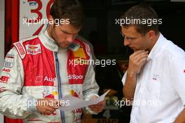 21.09.2007 Barcelona, Spain,  Martin Tomczyk (GER), Audi Sport Team Abt Sportsline, Portrait, looking at some technical data with an engineer - DTM 2007 at Circuit de Catalunya