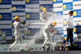 23.09.2007 Barcelona, Spain,  racewinner Jamie Green (GBR), Team HWA AMG Mercedes, AMG Mercedes C-Klasse in the middle of the champagne shower. On the right Gerhard Ungar (GER), Chief Designer AMG - DTM 2007 at Circuit de Catalunya