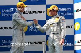 23.09.2007 Barcelona, Spain,  Podium, Paul di Resta (GBR), Persson Motorsport AMG Mercedes, Portrait (3rd, right), congratulates Jamie Green (GBR), Team HWA AMG Mercedes, Portrait (1st, left), with his fist victory - DTM 2007 at Circuit de Catalunya