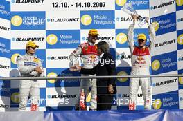 14.10.2007 Hockenheim, Germany,  The DTM 2007 championship podium: (middle) 1st Mattias Ekström (SWE), Audi Sport Team Abt Sportsline, Audi A4 DTM; (left) 2nd Bruno Spengler (CDN), Team HWA AMG Mercedes, AMG Mercedes C-Klasse; (right) 3rd Martin Tomczyk (GER), Audi Sport Team Abt Sportsline, Audi A4 DTM - DTM 2007 at Hockenheimring