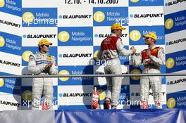 14.10.2007 Hockenheim, Germany,  The DTM 2007 championship podium: (middle) 1st Mattias Ekström (SWE), Audi Sport Team Abt Sportsline, Audi A4 DTM; (left) 2nd Bruno Spengler (CDN), Team HWA AMG Mercedes, AMG Mercedes C-Klasse; (right) 3rd Martin Tomczyk (GER), Audi Sport Team Abt Sportsline, Audi A4 DTM - DTM 2007 at Hockenheimring