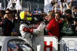 14.10.2007 Hockenheim, Germany,  (right) DTM champion 2007 Mattias Ekström (SWE), Audi Sport Team Abt Sportsline, Audi A4 DTM receives congratulations from (left) Bruno Spengler (CDN), Team HWA AMG Mercedes, AMG Mercedes C-Klasse. - DTM 2007 at Hockenheimring
