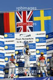 14.10.2007 Hockenheim, Germany,  The Hockenheim podium: (middle) 1st Jamie Green (GBR), Team HWA AMG Mercedes, AMG Mercedes C-Klasse; (left) 2nd Timo Scheider (GER), Audi Sport Team Abt Sportsline, Audi A4 DTM; (right) 3rd Mattias Ekström (SWE), Audi Sport Team Abt Sportsline, Audi A4 DTM - DTM 2007 at Hockenheimring