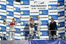 14.10.2007 Hockenheim, Germany,  Hockenheim podium. (left) Mattias Ekström (SWE), Audi Sport Team Abt Sportsline, Audi A4 DTM getting sprayed on with champagne by Jamie Green (GBR), Team HWA AMG Mercedes, AMG Mercedes C-Klasse - DTM 2007 at Hockenheimring