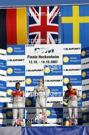 14.10.2007 Hockenheim, Germany,  The Hockenheim podium: (middle) 1st Jamie Green (GBR), Team HWA AMG Mercedes, AMG Mercedes C-Klasse; (left) 2nd Timo Scheider (GER), Audi Sport Team Abt Sportsline, Audi A4 DTM; (right) 3rd Mattias Ekström (SWE), Audi Sport Team Abt Sportsline, Audi A4 DTM - DTM 2007 at Hockenheimring