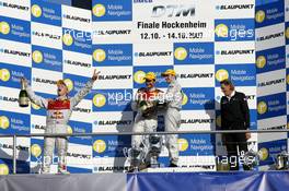 14.10.2007 Hockenheim, Germany,  Hockenheim podium. (left) Mattias Ekström (SWE), Audi Sport Team Abt Sportsline, Audi A4 DTM getting sprayed on with champagne by Jamie Green (GBR), Team HWA AMG Mercedes, AMG Mercedes C-Klasse - DTM 2007 at Hockenheimring