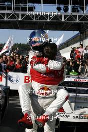 14.10.2007 Hockenheim, Germany,  DTM 2007 champio Mattias Ekström (SWE), Audi Sport Team Abt Sportsline, Audi A4 DTM jumps into his teammate Martin Tomczyk (GER), Audi Sport Team Abt Sportsline, Audi A4 DTM and receives his congratulations. - DTM 2007 at Hockenheimring