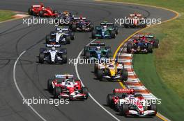 18.03.2007 Melbourne, Australia,  Takuma Sato (JPN), Super Aguri F1, SA07 and Jarno Trulli (ITA), Toyota Racing, TF107 - Formula 1 World Championship, Rd 1, Australian Grand Prix, Sunday Race