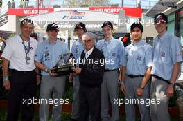 17.03.2007 Melbourne, Australia,  Bernie Ecclestone (GBR) hands the F1 In schools championship trophy to the Northern Ireland team - Formula 1 World Championship, Rd 1, Australian Grand Prix, Saturday