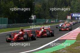 16.09.2007 Francorchamps, Belgium,  Race Start, Kimi Raikkonen (FIN), Räikkönen, Scuderia Ferrari leads Felipe Massa (BRA), Scuderia Ferrari - Formula 1 World Championship, Rd 14, Belgium Grand Prix, Sunday Race