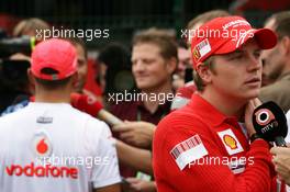 19.10.2007 Sao Paulo, Brazil,  Kimi Raikkonen (FIN), Räikkönen, Scuderia Ferrari and Lewis Hamilton (GBR), McLaren Mercedes in the background - Formula 1 World Championship, Rd 17, Brazilian Grand Prix, Friday
