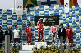 21.10.2007 Sao Paulo, Brazil,  Felipe Massa (BRA), Scuderia Ferrari, Kimi Raikkonen (FIN), Räikkönen, Scuderia Ferrari, Fernando Alonso (ESP), McLaren Mercedes - Formula 1 World Championship, Rd 17, Brazilian Grand Prix, Sunday Podium