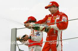 21.10.2007 Sao Paulo, Brazil,  Kimi Raikkonen (FIN), Räikkönen, Scuderia Ferrari, F2007 and Fernando Alonso (ESP), McLaren Mercedes, MP4-22 - Formula 1 World Championship, Rd 17, Brazilian Grand Prix, Sunday Podium