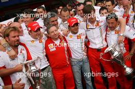 21.10.2007 Sao Paulo, Brazil,  new world champion Kimi Raikkonen (FIN), Räikkönen, Scuderia Ferrari with Jean Todt (FRA), Scuderia Ferrari, Ferrari CEO, Felipe Massa (BRA), Scuderia Ferrari, Rob Smedly, (GBR), Scuderia Ferrari, Track Engineer of Felipe Massa (BRA) - Formula 1 World Championship, Rd 17, Brazilian Grand Prix, Sunday Podium