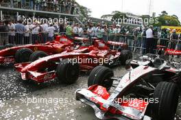 21.10.2007 Sao Paulo, Brazil,  Scuderia Ferrari, F2007 and McLaren Mercedes, MP4-22 , covered in glitter - Formula 1 World Championship, Rd 17, Brazilian Grand Prix, Sunday Podium