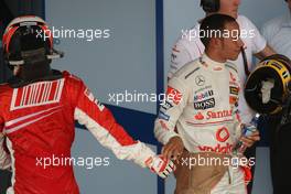 21.10.2007 Sao Paulo, Brazil,  new world champion Kimi Raikkonen (FIN), Räikkönen, Scuderia Ferrari and Lewis Hamilton (GBR), McLaren Mercedes - Formula 1 World Championship, Rd 17, Brazilian Grand Prix, Sunday Podium