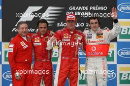 21.10.2007 Sao Paulo, Brazil,  Jean Todt (FRA), Scuderia Ferrari, Ferrari CEO with 2nd place Felipe Massa (BRA), Scuderia Ferrari and 1st place and new world champion and 3rd place Fernando Alonso (ESP), McLaren Mercedes - Formula 1 World Championship, Rd 17, Brazilian Grand Prix, Sunday Podium