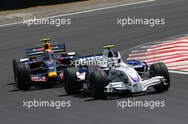 21.10.2007 Sao Paulo, Brazil,  Robert Kubica (POL), BMW Sauber F1 Team, F1.07 leads Mark Webber (AUS), Red Bull Racing, RB3 - Formula 1 World Championship, Rd 17, Brazilian Grand Prix, Sunday Race