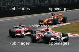 21.10.2007 Sao Paulo, Brazil,  Anthony Davidson (GBR), Super Aguri F1 Team, SA07 leads Ralf Schumacher (GER), Toyota Racing, TF107 - Formula 1 World Championship, Rd 17, Brazilian Grand Prix, Sunday Race