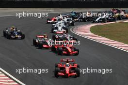 21.10.2007 Sao Paulo, Brazil,  Start, Felipe Massa (BRA), Scuderia Ferrari, F2007, Kimi Raikkonen (FIN), Räikkönen, Scuderia Ferrari, F2007 and Lewis Hamilton (GBR), McLaren Mercedes, MP4-22, Fernando Alonso (ESP), McLaren Mercedes, MP4-22  - Formula 1 World Championship, Rd 17, Brazilian Grand Prix, Sunday Race