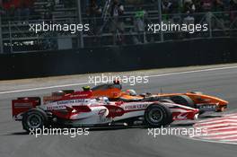 21.10.2007 Sao Paulo, Brazil,  Anthony Davidson (GBR), Super Aguri F1 Team, SA07 and Adrian Sutil (GER), Spyker F1 Team, F8-VII-B - Formula 1 World Championship, Rd 17, Brazilian Grand Prix, Sunday Race