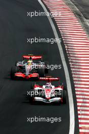 21.10.2007 Sao Paulo, Brazil,  Takuma Sato (JPN), Super Aguri F1, Lewis Hamilton (GBR), McLaren Mercedes - Formula 1 World Championship, Rd 17, Brazilian Grand Prix, Sunday Race