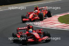 21.10.2007 Sao Paulo, Brazil,  Felipe Massa (BRA), Scuderia Ferrari, F2007 leads Kimi Raikkonen (FIN), Räikkönen, Scuderia Ferrari, F2007 - Formula 1 World Championship, Rd 17, Brazilian Grand Prix, Sunday Race