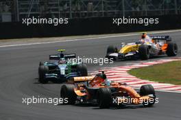 21.10.2007 Sao Paulo, Brazil,  Adrian Sutil (GER), Spyker F1 Team, F8-VII-B leads Rubens Barrichello (BRA), Honda Racing F1 Team, RA107 - Formula 1 World Championship, Rd 17, Brazilian Grand Prix, Sunday Race