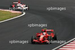 21.10.2007 Sao Paulo, Brazil,  Kimi Raikkonen (FIN), Räikkönen, Scuderia Ferrari, Takuma Sato (JPN), Super Aguri F1 - Formula 1 World Championship, Rd 17, Brazilian Grand Prix, Sunday Race