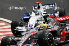 21.10.2007 Sao Paulo, Brazil,  Lewis Hamilton (GBR), McLaren Mercedes, MP4-22 leads Nick Heidfeld (GER), BMW Sauber F1 Team, F1.07 - Formula 1 World Championship, Rd 17, Brazilian Grand Prix, Sunday Race