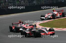 21.10.2007 Sao Paulo, Brazil,  Lewis Hamilton (GBR), McLaren Mercedes, MP4-22 leads Takuma Sato (JPN), Super Aguri F1, SA07 - Formula 1 World Championship, Rd 17, Brazilian Grand Prix, Sunday Race