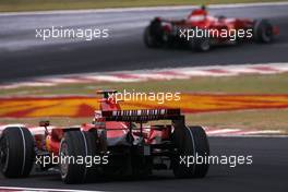 21.10.2007 Sao Paulo, Brazil,  Kimi Raikkonen (FIN), Räikkönen, Scuderia Ferrari Felipe Massa (BRA), Scuderia Ferrari - Formula 1 World Championship, Rd 17, Brazilian Grand Prix, Sunday Race