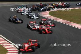 21.10.2007 Sao Paulo, Brazil,  Start, Felipe Massa (BRA), Scuderia Ferrari, F2007, Kimi Raikkonen (FIN), Räikkönen, Scuderia Ferrari, F2007 and Lewis Hamilton (GBR), McLaren Mercedes, MP4-22, Fernando Alonso (ESP), McLaren Mercedes, MP4-22  - Formula 1 World Championship, Rd 17, Brazilian Grand Prix, Sunday Race