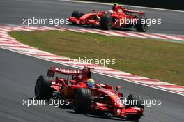 21.10.2007 Sao Paulo, Brazil,  Felipe Massa (BRA), Scuderia Ferrari, F2007 leads Kimi Raikkonen (FIN), Räikkönen, Scuderia Ferrari, F2007 - Formula 1 World Championship, Rd 17, Brazilian Grand Prix, Sunday Race