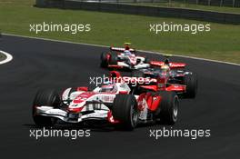 21.10.2007 Sao Paulo, Brazil,  Takuma Sato (JPN), Super Aguri F1, Lewis Hamilton (GBR), McLaren Mercedes - Formula 1 World Championship, Rd 17, Brazilian Grand Prix, Sunday Race