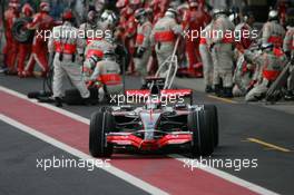 21.10.2007 Sao Paulo, Brazil,  Fernando Alonso (ESP), McLaren Mercedes, MP4-22 pit stop - Formula 1 World Championship, Rd 17, Brazilian Grand Prix, Sunday Race