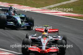 21.10.2007 Sao Paulo, Brazil,  Lewis Hamilton (GBR), McLaren Mercedes, MP4-22 leads Rubens Barrichello (BRA), Honda Racing F1 Team, RA107 - Formula 1 World Championship, Rd 17, Brazilian Grand Prix, Sunday Race