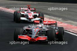 21.10.2007 Sao Paulo, Brazil,  Fernando Alonso (ESP), McLaren Mercedes, Takuma Sato (JPN), Super Aguri F1 - Formula 1 World Championship, Rd 17, Brazilian Grand Prix, Sunday Race