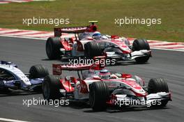 21.10.2007 Sao Paulo, Brazil,  Takuma Sato (JPN), Super Aguri F1, SA07 and Anthony Davidson (GBR), Super Aguri F1 Team, SA07 - Formula 1 World Championship, Rd 17, Brazilian Grand Prix, Sunday Race