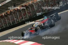 21.10.2007 Sao Paulo, Brazil,  Lewis Hamilton (GBR), McLaren Mercedes, MP4-22 locks up a wheel into the first corner - Formula 1 World Championship, Rd 17, Brazilian Grand Prix, Sunday Race