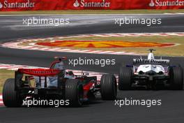 21.10.2007 Sao Paulo, Brazil,  Fernando Alonso (ESP), McLaren Mercedes, Nick Heidfeld (GER), BMW Sauber F1 Team  - Formula 1 World Championship, Rd 17, Brazilian Grand Prix, Sunday Race